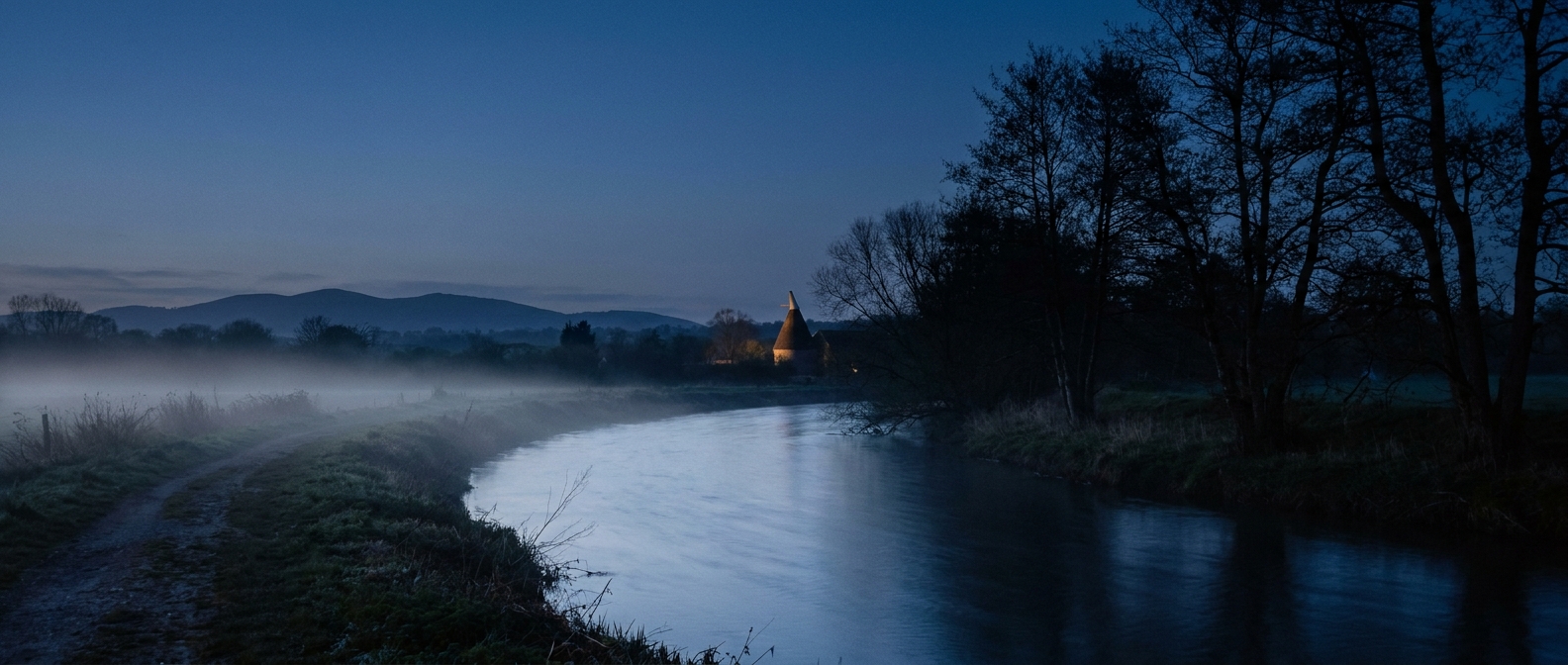 The River Frome at dusk, running south along the eastern edge of Bishop's Frome — a slow, steady current photographed in low blue-hour light.